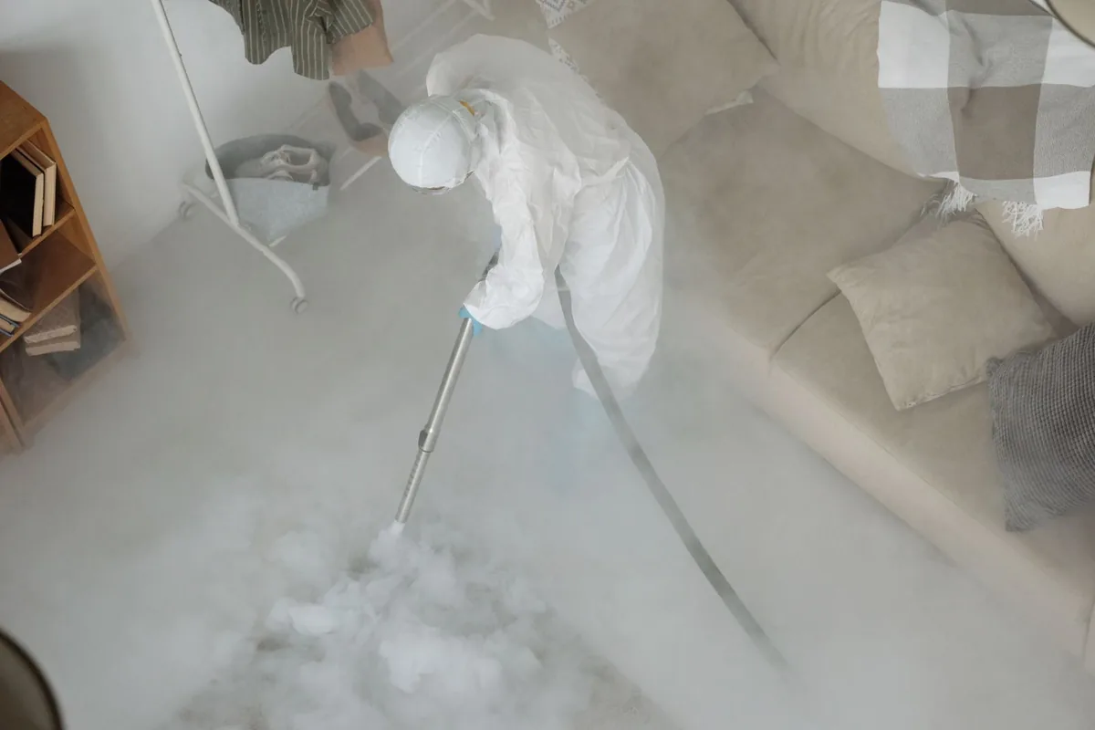 Biohazard cleanup technician in protective equipment, Shady Shores, TX